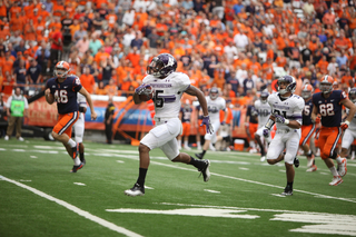 Northwestern running back Venric Mark returns a punt for a touchdown in the first half. 