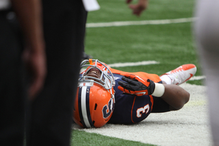 Safety Durell Eskridge lays in pain after a play in the first half.