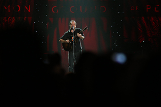 Dave Matthews performs on stage.