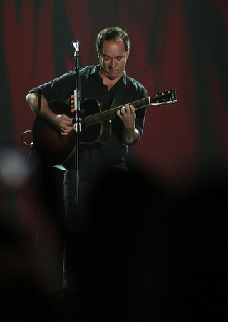 Dave Matthews performs on stage.