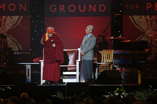 The Dalai Lama smiles as he speaks to the crowd in the Carrier Dome on Tuesday.