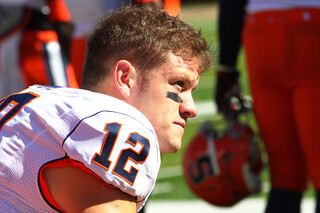 Ryan Nassib sits on the sidelines during Syracuse's 23-15 loss to Rutgers.