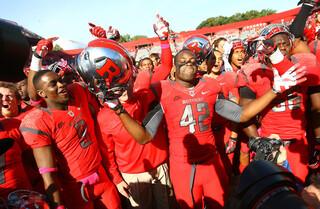 Linebacker Steve Beauharnais (42) leads the Rutgers celebration after the game.