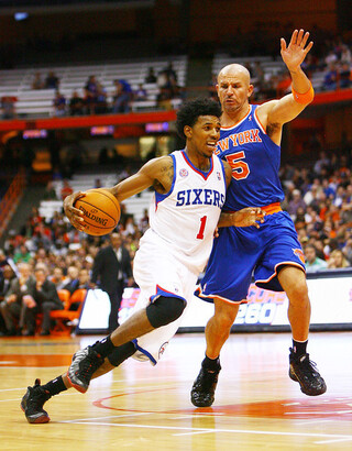 Nick Young of the Philadelphia 76ers drives to the basket against Jason Kidd of the New York Knicks.