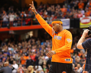 Carmelo Anthony waves to the Carrier Dome crowd as he is announced with the New York Knicks' starting lineup.