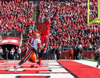 Rutgers wide receiver Brandon Coleman can't quite bring in a high pass in the end zone as Syracuse cornerback Brandon Reddish gives him a push.
