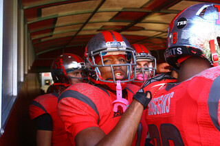 Rutgers players prepare to run out of the tunnel before kickoff.