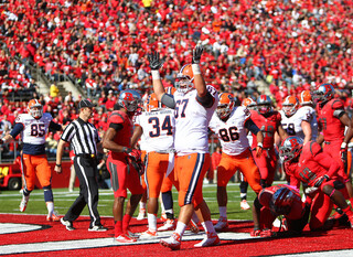 Syracuse offensive lineman Justin Pugh celebrates the Orange's touchdown in the second quarter in Piscataway, N.J.