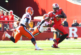 Syracuse safety Durell Eskridge (3) tries to bring down Rutgers wide receiver Brandon Coleman.