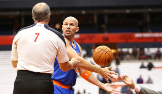 Jason Kidd of the New York Knicks looks to the official to argue a call against the Philadelphia 76ers at the Carrier Dome.