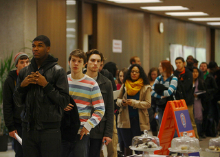 Students line up to vote in Bird Library on Tuesday.