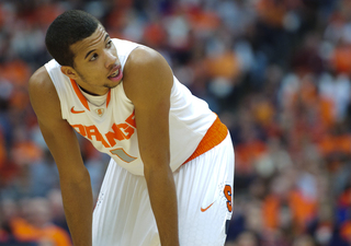 Syracuse guard Michael Carter-Williams catches his breath during a pause in the game.