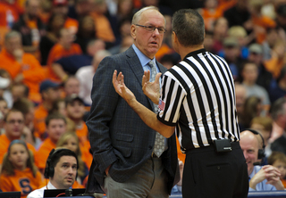 Syracuse head coach Jim Boeheim listens to an official.