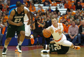 Syracuse guard Trevor Cooney dives for a loose ball.