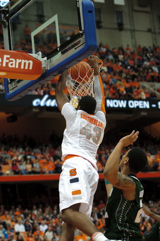 Syracuse forward James Southerland slams a dunk home from the baseline.