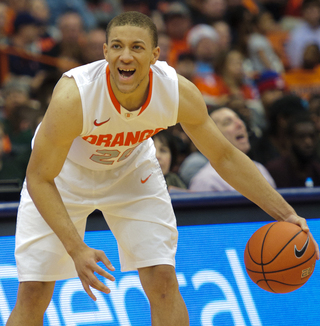 Syracuse guard Brandon Triche calls out to his team.