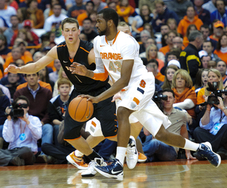 Syracuse forward James Southerland dribbles around the Princeton defense.