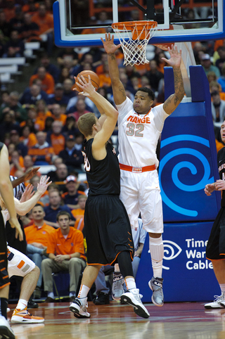 DaJuan Coleman stands tall against a Princeton forward Hans Brase in the paint. SU forced 24 turnovers.