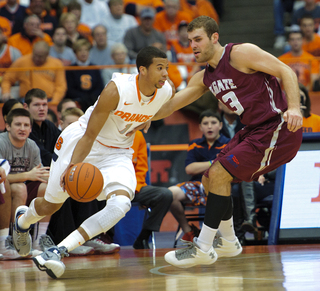 Michael Carter-Williams looks to drive against Colgate on Sunday.