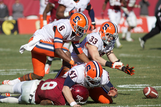 Dan Vaughan (33) dives to recover a fumble after Temple's Montel Harris failed to field a punt cleanly.