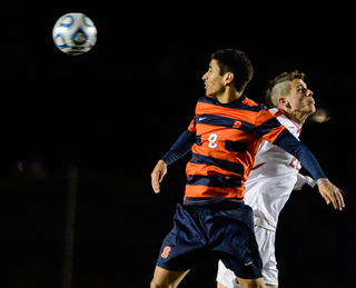 Syracuse's Nick Perea goes up for a header against Cornell at Berman Field in Ithaca, N.Y.