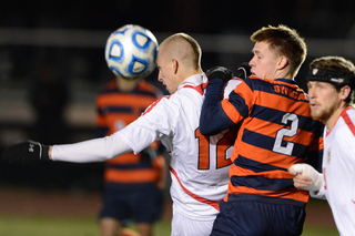 Jordan Vale (2) tries to get position against Cornell defender Patrick Slogic (12) in Syracuse's 1-0 win over the Big Red on Thursday night.