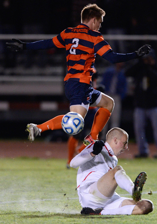 Jordan Vale gets tangled up with a Cornell defender going after the ball in SU's NCAA tournament game.