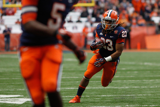 Syracuse running back Prince-Tyson Gulley (23) runs with some open space.