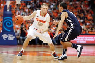 Trevor Cooney dribbles past Monmouth's Max DiLeo in the Orange's win over the Hawks.