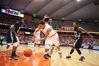 Michael Carter-Williams goes for a loose ball in the Orange's victory over Monmouth.