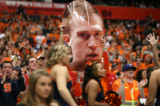 Fans display a big head of Syracuse guard Trevor Cooney. Cooney scored 15 points, all coming from behind the arc.