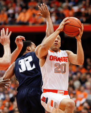 Syracuse guard Brandon Triche attempts a layup in the Orange's win over Monmouth on Saturday. Triche scored 18 points and had eight assists.