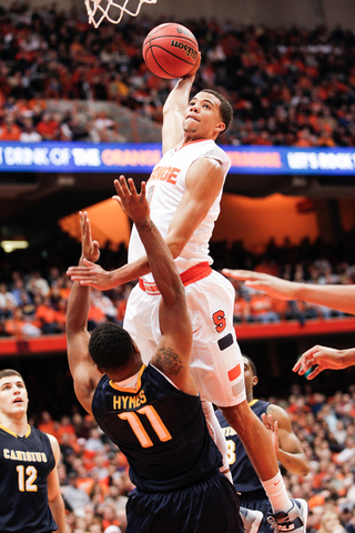Syracuse guard Michael Carter-Williams attempts a one-handed slam.