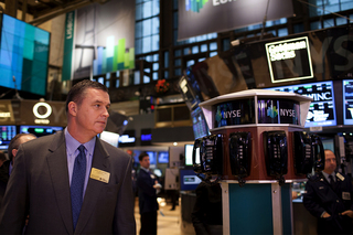 Syracuse head coach Doug Marrone stands on the floor of the New York Stock Exchange on Thursday.