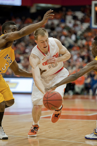 Trevor Cooney dribbles through traffic in the second half of Syracuse's victory.