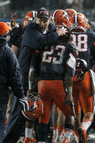 Doug Marrone puts his arm around Prince-Tyson Gulley as the running back comes off the field.
