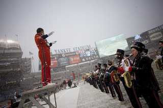 The Syracuse University Marching Band practices in the snow before the game. Forecasts call for 1-3 inches for game day. Syracuse takes on West Virginia in the 2012 Pinstripe Bowl at a snowy Yankee Stadium on Saturday, Dec. 29, 2012, in New York City. 