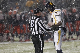 Geno Smith quarterback for West Virginia, has words for the referee after being taken down in the end zone for a safety.