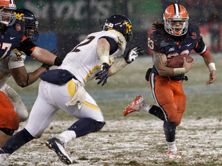 Prince-Tyson Gulley takes a hand off.  Syracuse takes on West Virginia in the 2012 Pinstripe Bowl at a snowy Yankee Stadium on Wednesday, December 26, 2012 in New York, New York.