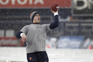 Syracuse long snapper Sam Rodgers (47) throws a football in the snow before the game. Syracuse takes on West Virginia in the 2012 Pinstripe Bowl at a snowy Yankee Stadium on Saturday, Dec. 29, 2012, in New York City. 