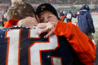 Syracuse Chancellor Nancy Cantor gives quarterback Ryan Nassib a hug after the game.