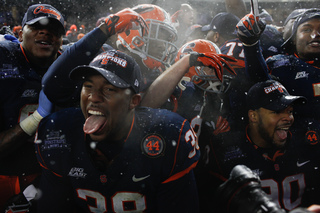 Cameron Lynch (38) and Syracuse celebrate their victory after the game.