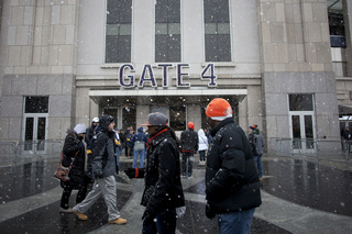 Syracuse fans wait outside in the snow for Yankee Stadium to open to the public. Syracuse takes on West Virginia in the 2012 Pinstripe Bowl at a snowy Yankee Stadium on Saturday, Dec. 29, 2012, in New York City. 
