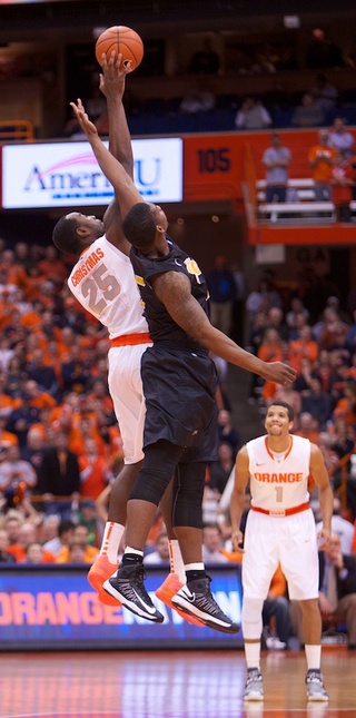 Syracuse University forward Rakeem Christmas (25) controls the opening tip for Syracuse Thursday night at the Carrier Dome. Christmas finished the game with a career high 11 points to go with his five rebounds. 