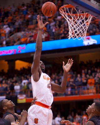 Syracuse University forward Rakeem Christmas puts back a rebound during the first quarter of The Orange's rout of Long Beach State Thursday at the Carrier Dome. 
