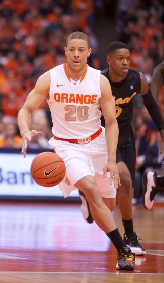 Syracuse University guard Brandon Triche brings the ball up the court during a fast break. 