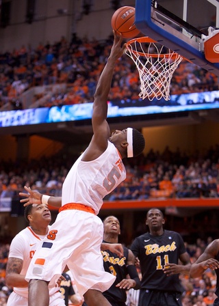 Syracuse University forward C.J. Fair connects on a reverse layup during the first half of the Orange's rout of Long Beach State Thursday at the Carrier Dome. Fair had one of his best games of the season, registering a double-double with 16 points and 13 rebounds. 