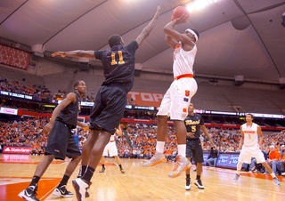 Syracuse University forward C.J. Fair shoots a fadeaway jumper during the second half of the Orange's rout of Long Beach State Thursday at the Carrier Dome.