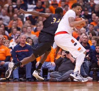 Syracuse University center DaJuan Coleman (32) controls the rebound late in the second half of Syracuse's rout of Long Beach State Thursday in the Carrier Dome. 