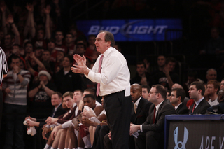 Temple head coach Fran Dunphy claps and shouts direction to his players during their upset of the Orange.